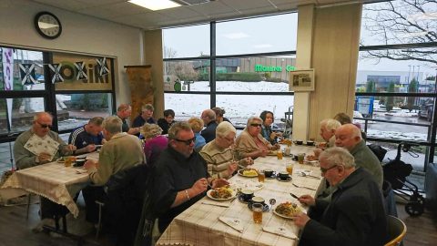 BPS Social Group Burns Supper with people enjoying their food