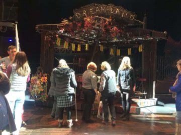 Theatre Group on stage feeling the 'Dreamland' set
