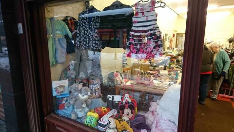 Our open charity shop in Grangemouth. Shop window with kids items