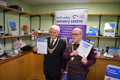 Provost Buchanan recognises John's volunteer work with Action on Hearing Loss