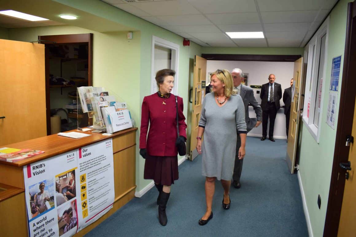 HRH The Princess Royal walking to the resource area with Jacquie