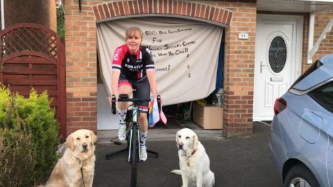 Laura on her 500 Mile Cycle Challenge with Guide Dogs Rolo and Pixie