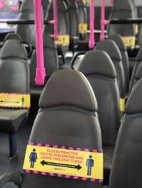 Closed seating with yellow social distancing signs
