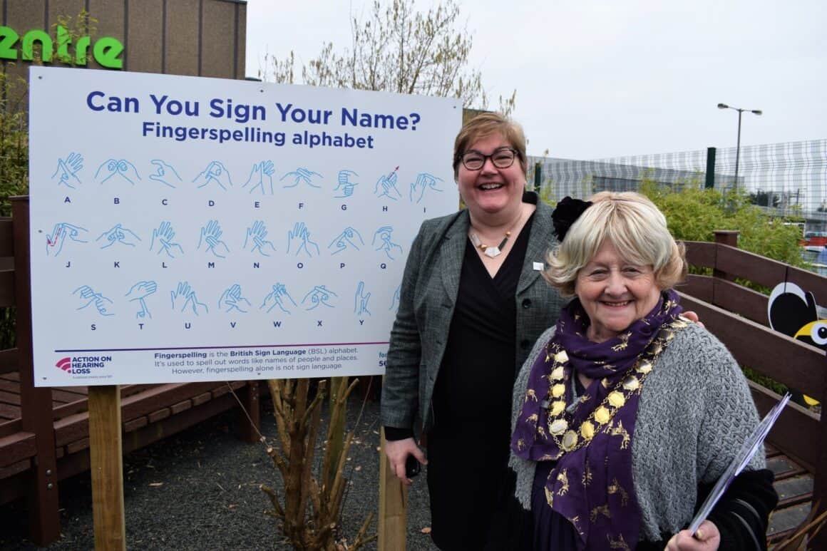 Teri from action on hearing loss and Clackmannanshire Provost with BSL board