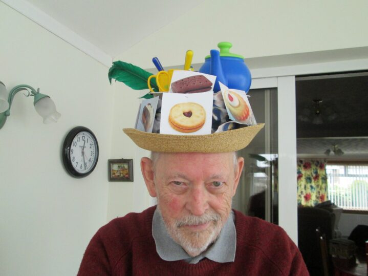 John Ormsby wearing his winning hat with feather and teapot just visible