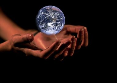 hands with a globe/earth