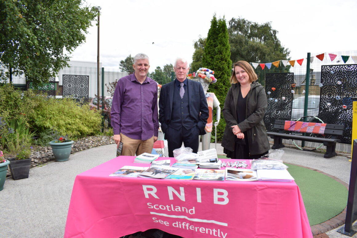 RNIB table with James, Cllr Mooney and Rachel