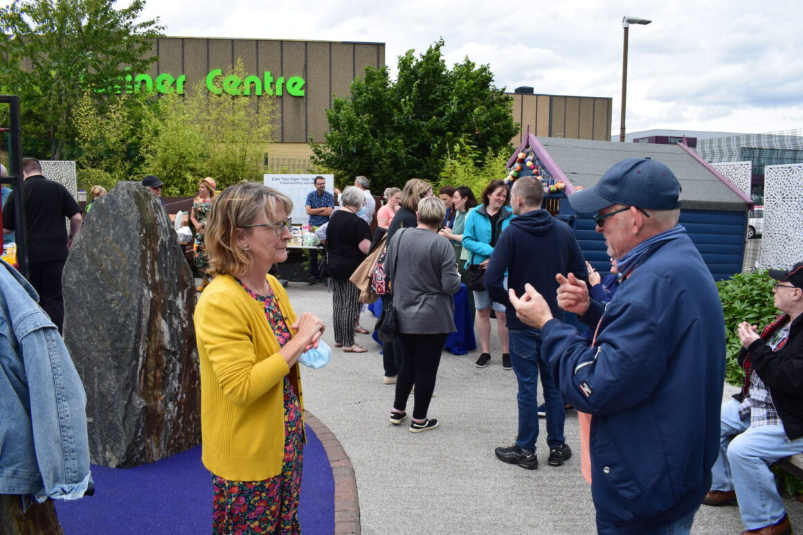 Caroline speakign with a Deaf Centre User
