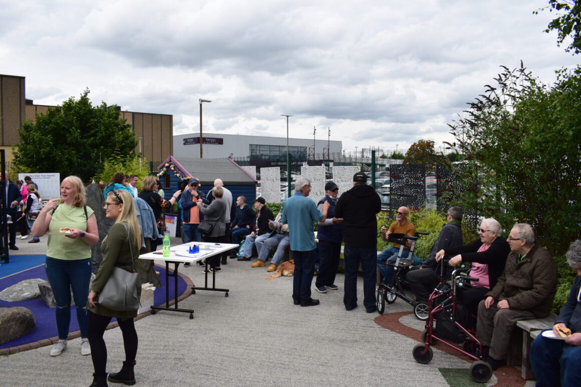 Centre Users seated on sensory garden