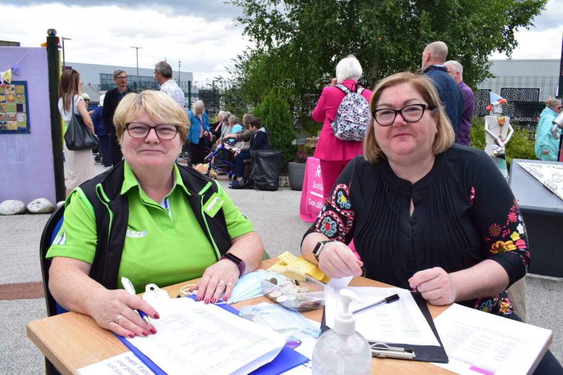 Margaret Bradie and Teri Devine of RNID at entry desk