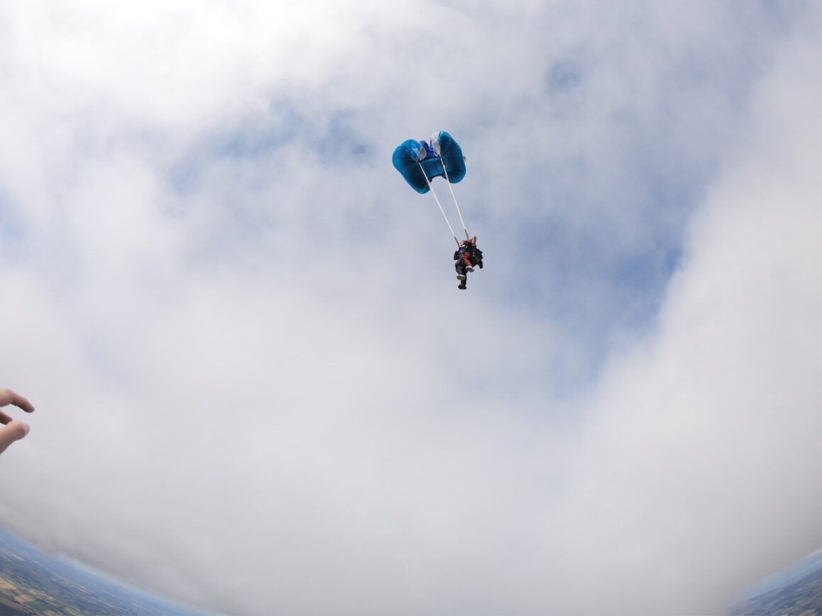 Looking up from the ground at the open parachute