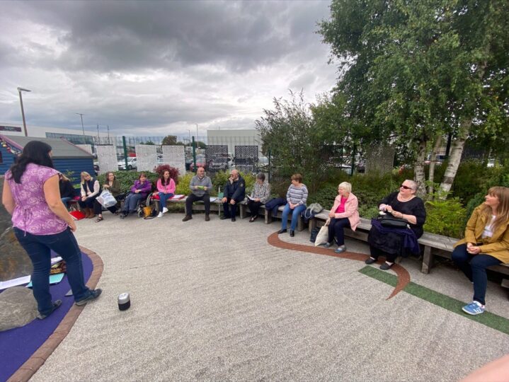 Catriona and singer gathered in Sensory Garden