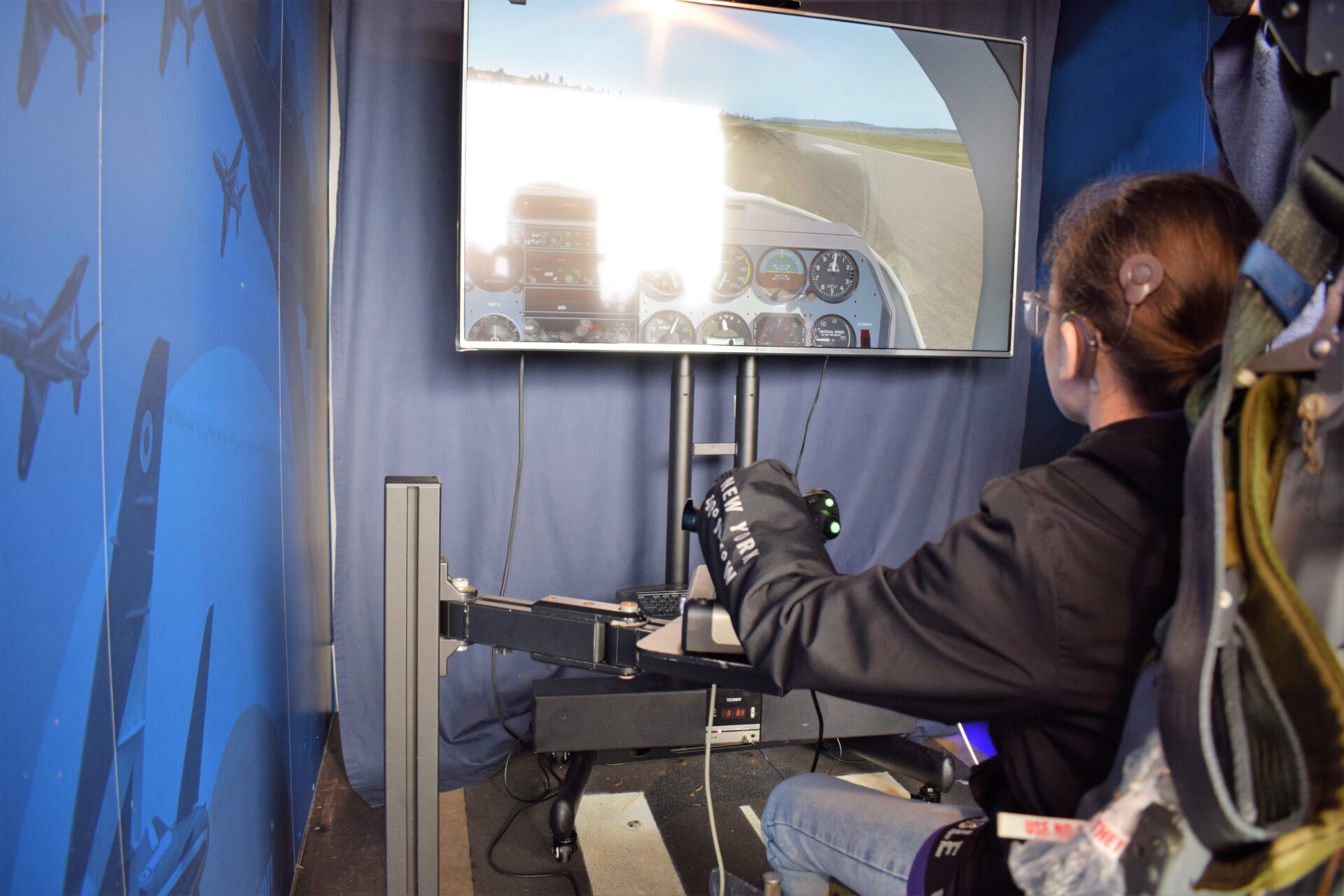Brooke at the controls of the simulator