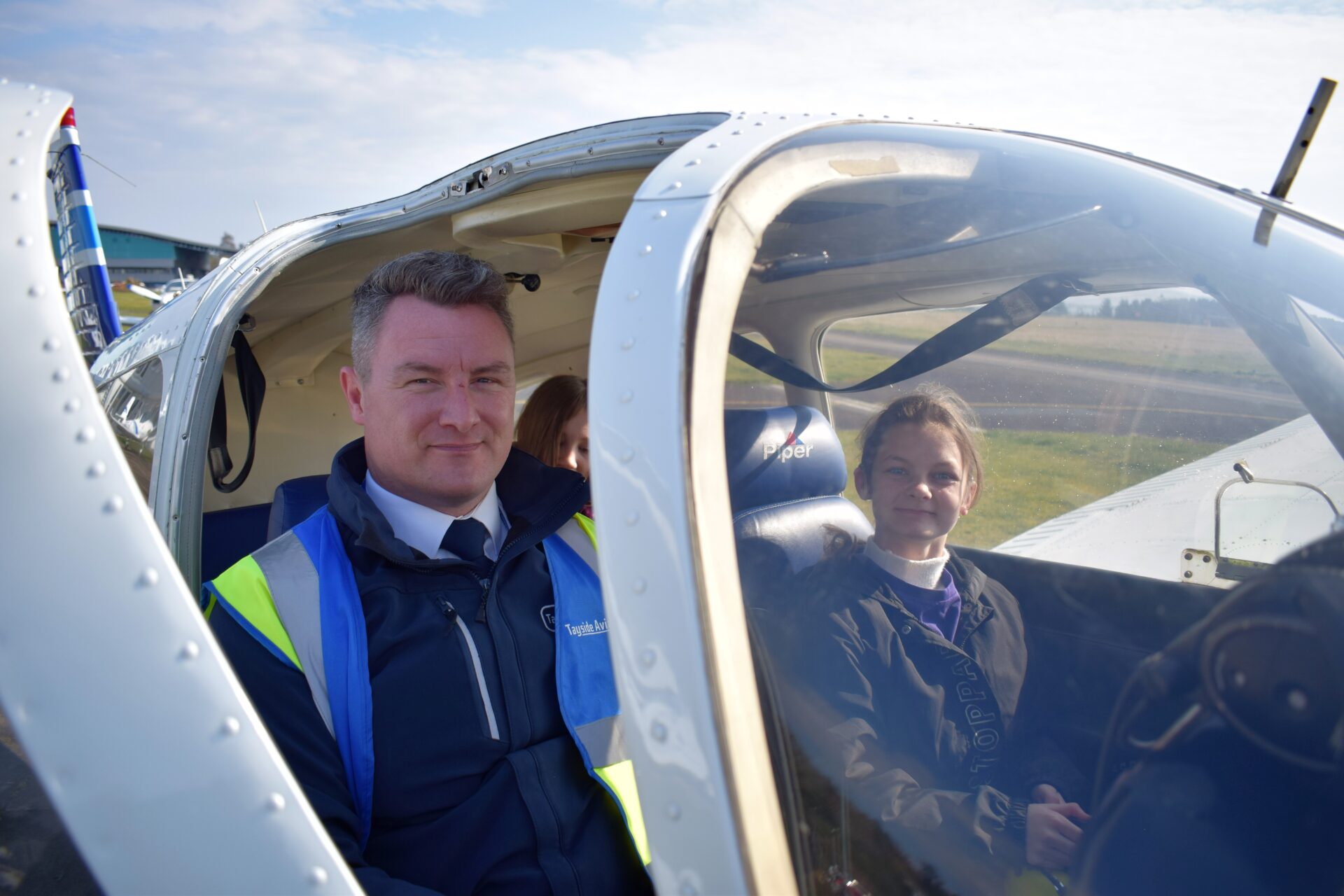 Brooke in plane with pilot Andrew