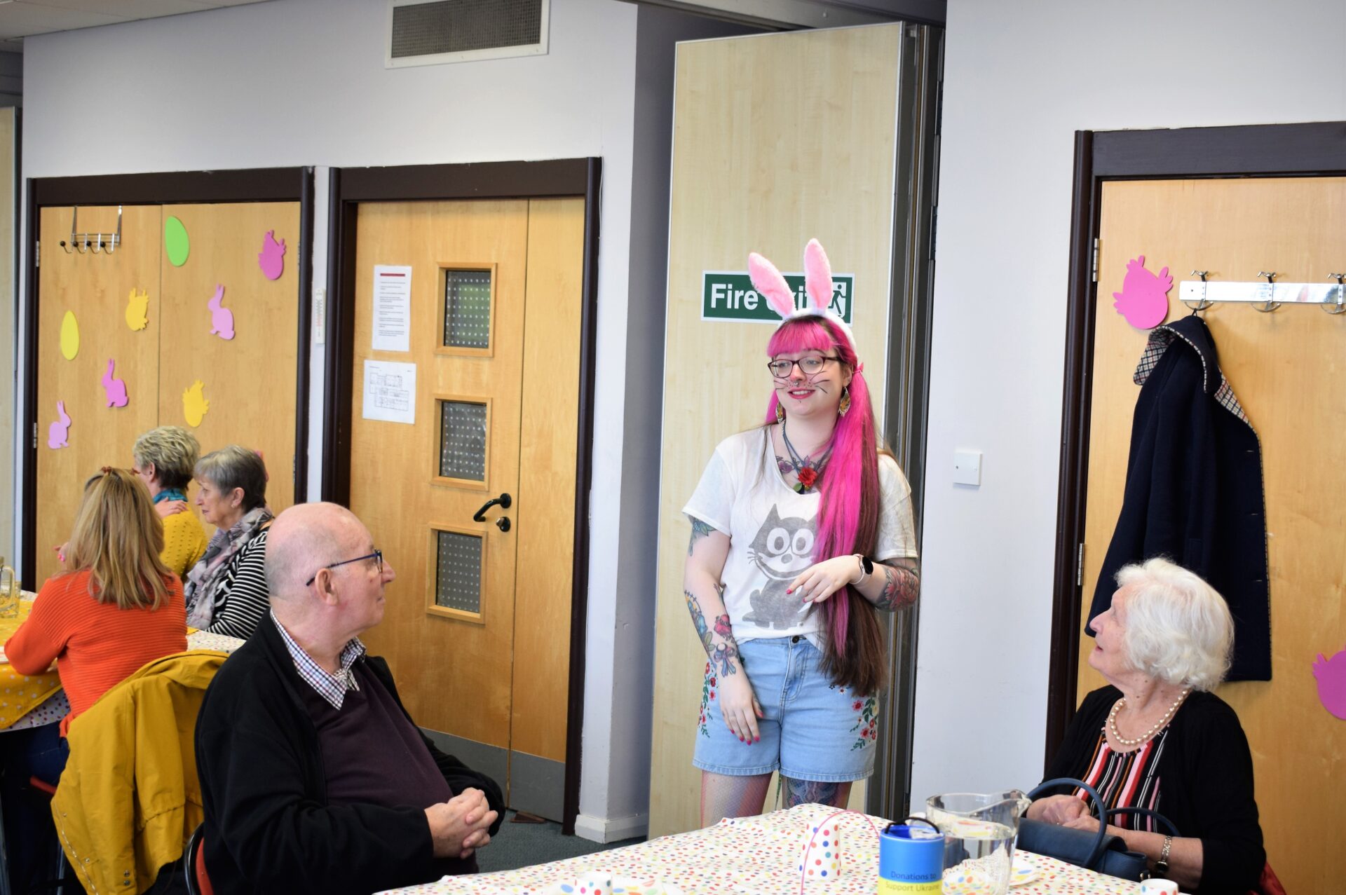 Hannah interpreting BSL for our deaf visitors while dressed as a bunny