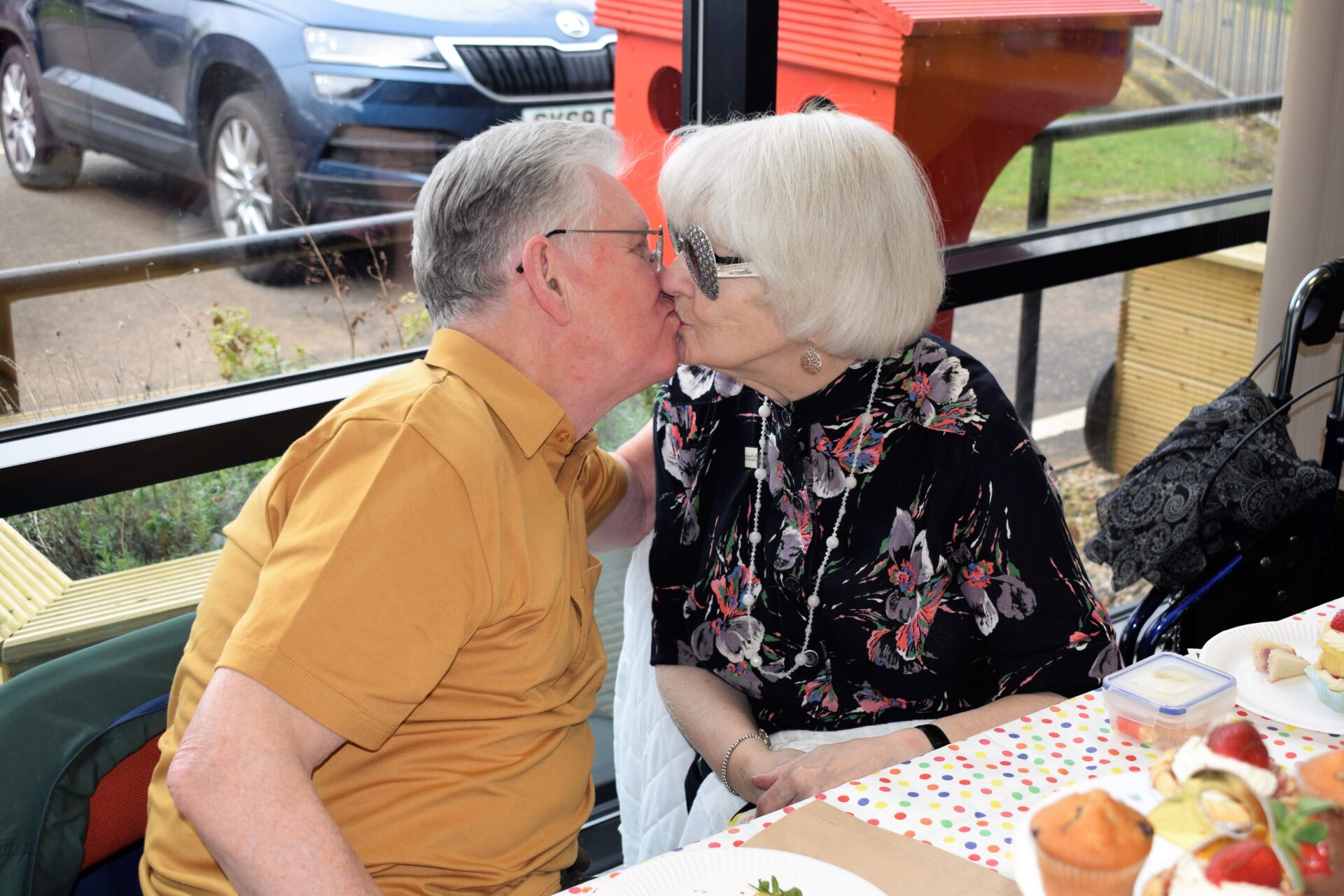 two people share a kiss
