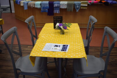 Top view of cafe table with yellow cloth