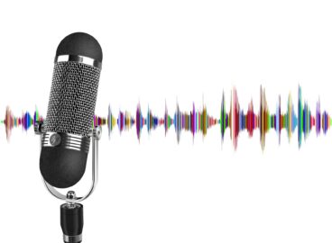 Microphone with multicoloured radio waves in the background