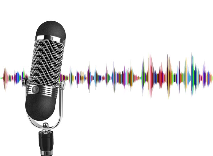 Microphone with multicoloured radio waves in the background